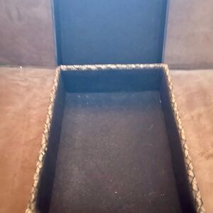 Small wicker box with stitched leather lid